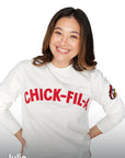 Woman standing wearing Heritage Doodles Crewneck