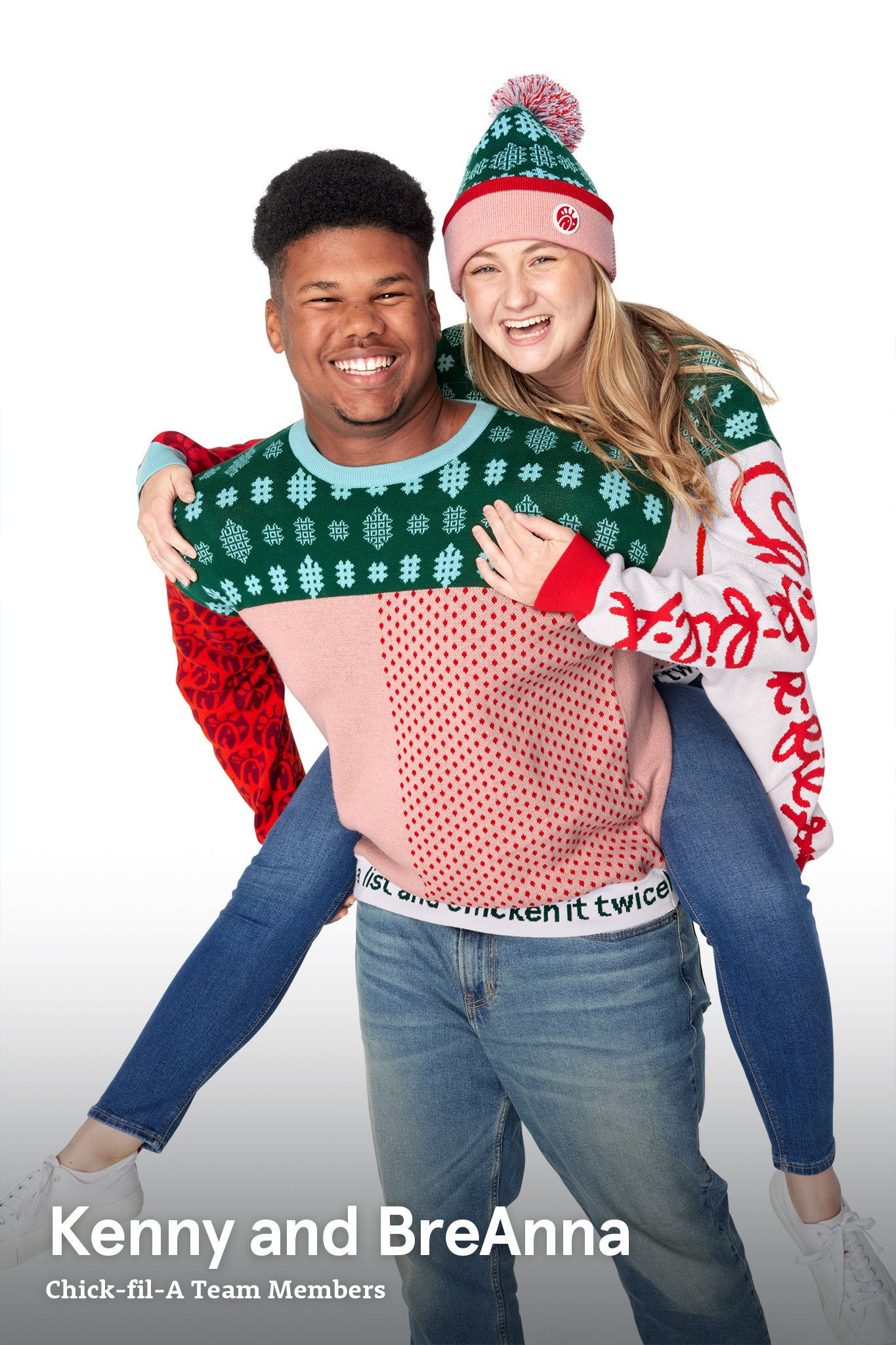 Man wearing a Festive Fun Sweater carrying a woman wearing a Festive Fun Sweater and Festive Fun Pom Beanie