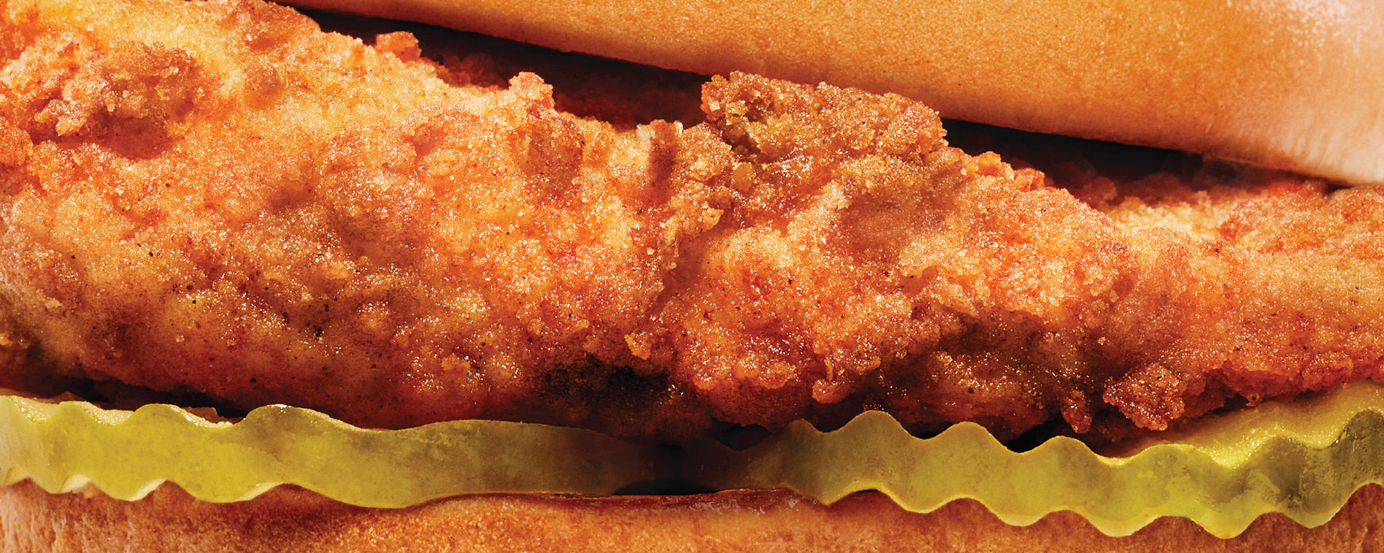 Close up of Original Chick-fil-A® Chicken Sandwich with pickles