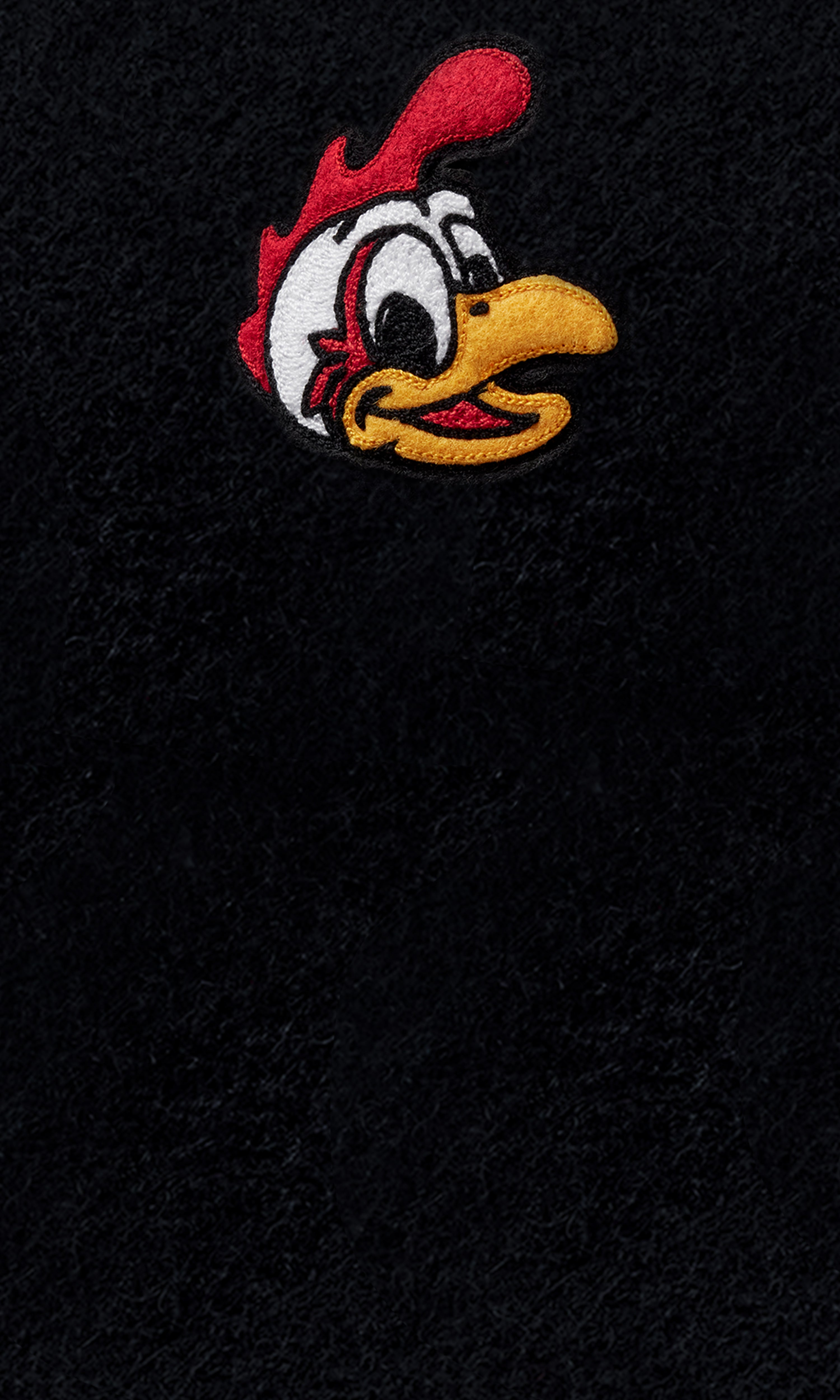 Close-up of Doodles patch on wool background