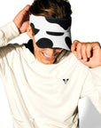 Man wearing Lightweight Cow Pullover hoodie with Adjustable Cow Print Visor.