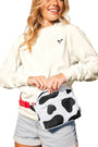 Woman with blonde hair wearing Lightweight Cow Pullover and Cow Print Belt Bag as fanny pack.