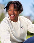 Man wearing off-white Embroidered Cow Crewneck