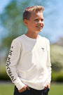 Boy wearing Eat Mor Chikin® Kids Graphic Long Sleeve Shirt