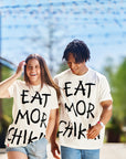 Man and woman wearing Eat Mor Chikin® Graphic Tees