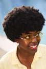 Woman wearing yellow tinted Waffle Fry Novelty Glasses