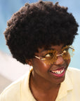 Woman wearing yellow tinted Waffle Fry Novelty Glasses