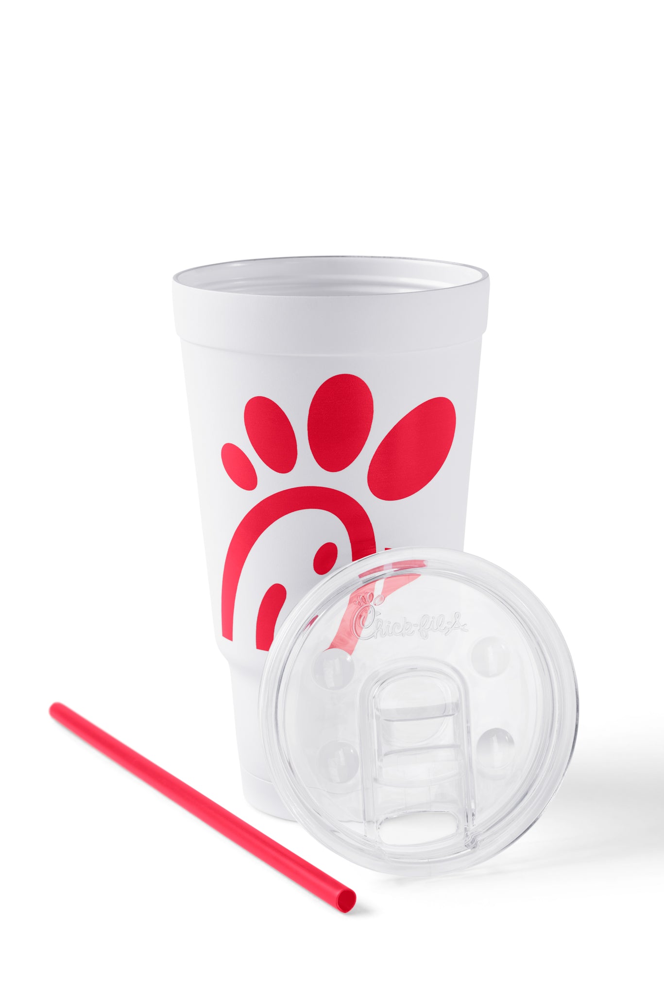 The Original Chick-fil-A 24oz Insulated Tumbler with straw and lid sitting in front of it