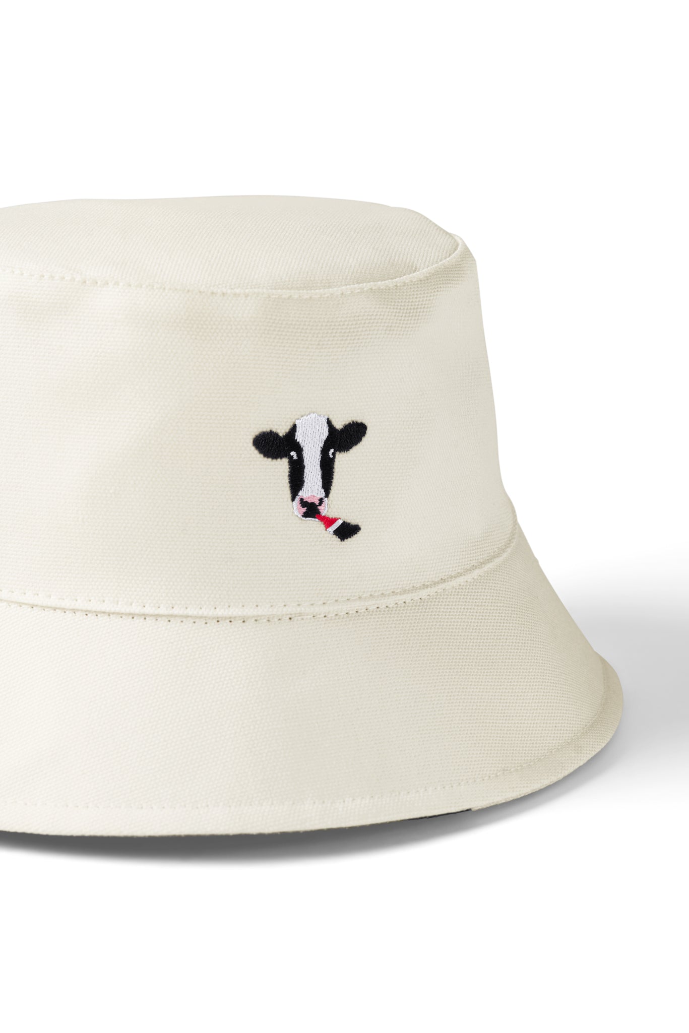 Close up of cow embroidery on Reversible Cow Print Bucket Hat