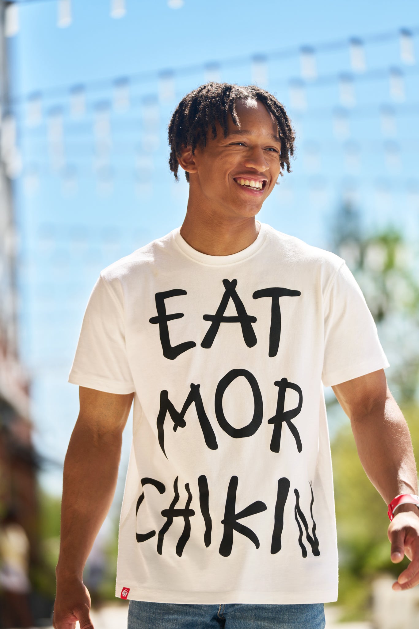 Man wearing black and white Eat Mor Chikin® Graphic Tee