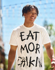 Man wearing black and white Eat Mor Chikin® Graphic Tee