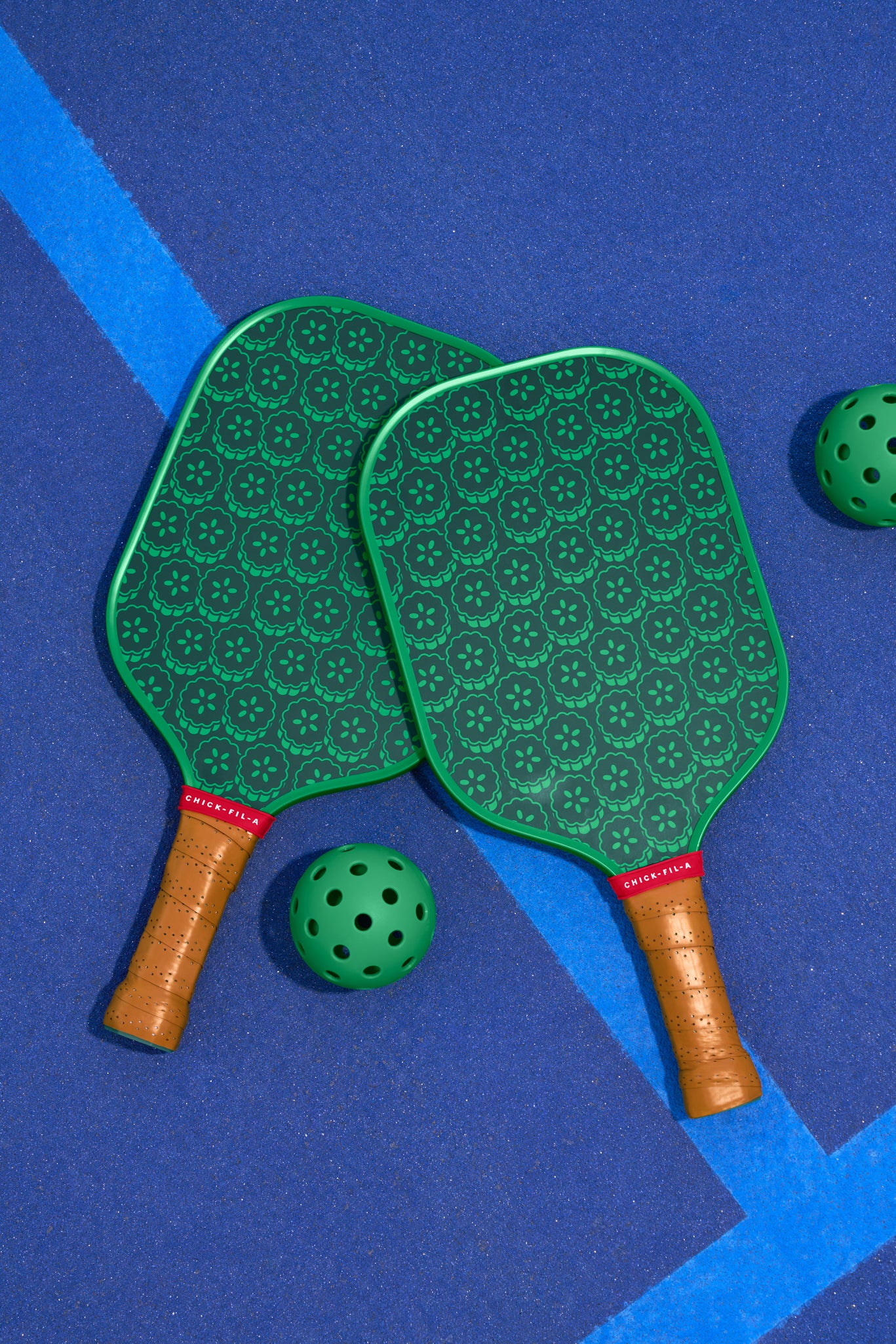 Pickle Pickle™ Pickleball Set with 2 paddles and 2 green balls on court