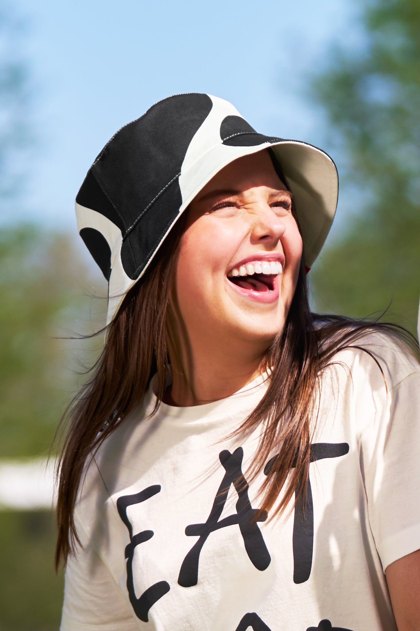 Woman wearing Adult Reversible Cow Print Bucket Hat