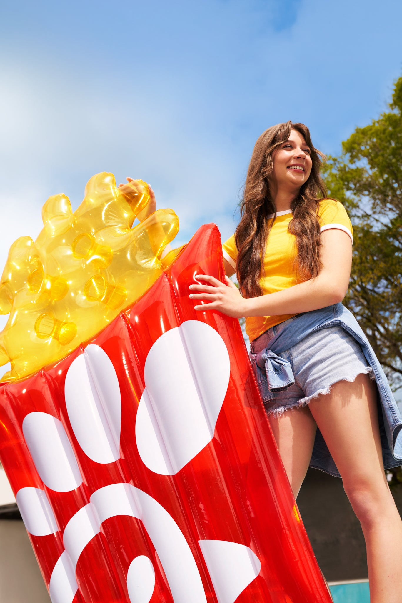 Woman holding Large Waffle Fry Pool Float 