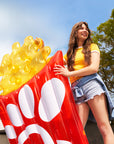 Woman holding Large Waffle Fry Pool Float 