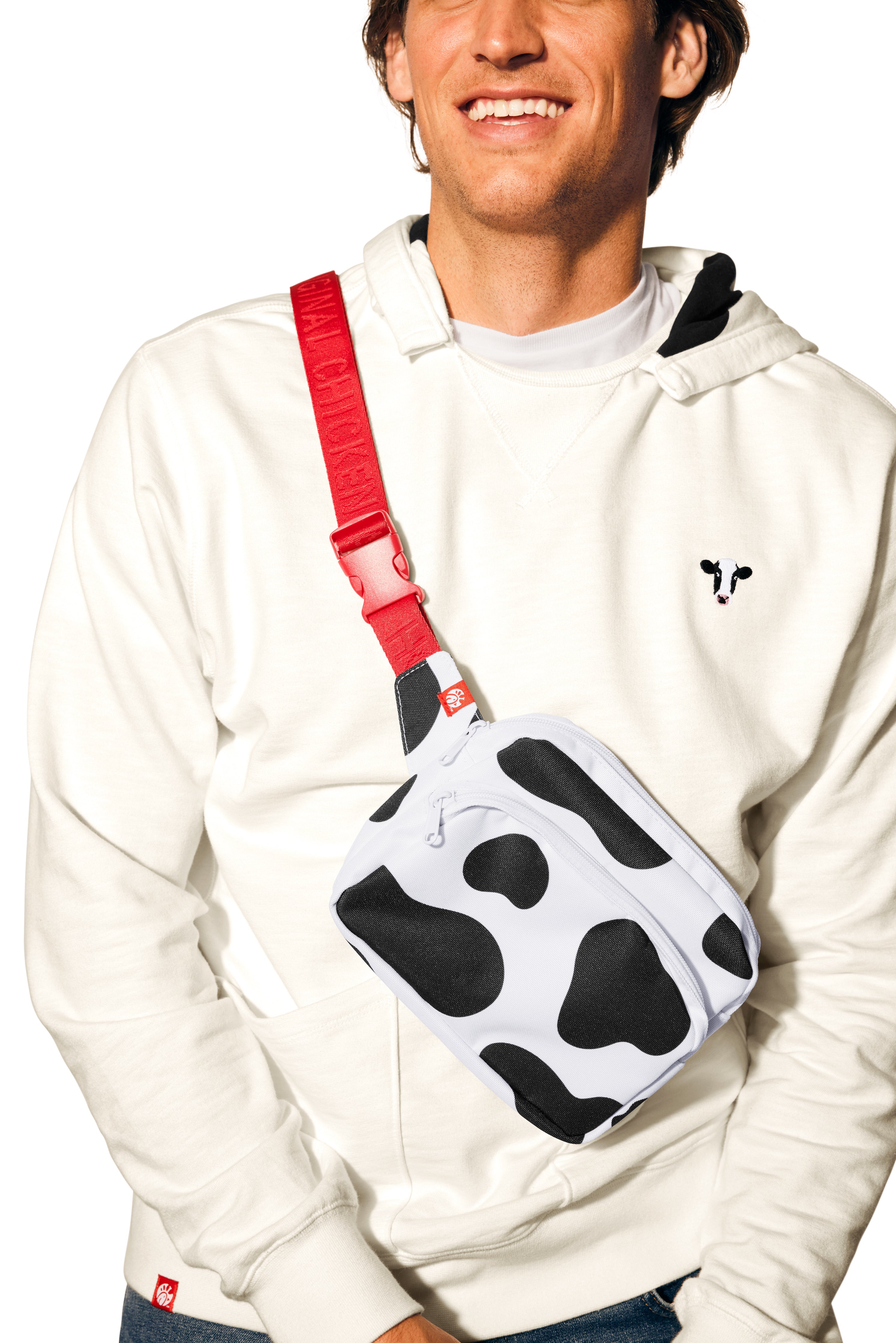 Man wearing Lightweight Cow Pullover and Cow Print Belt Bag