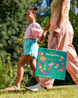 SquiggleHop™ Life-size Board Game - woman carrying board game and holding girl's hand - pennycake