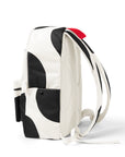 Side view of Cow Print Backpack with shoulder straps and water bottle pocket