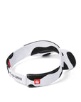 Back view of black and white cow print visor with red logo silicone tag