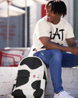 Man sitting with Cow Print Backpack