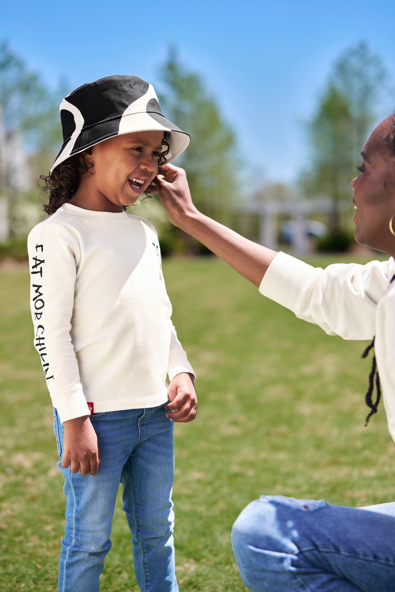 Mom with daughter wearing Kids Reversible Cow Print Bucket Hat