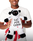 Man wearing Chick-fil-A Logo Print Tee standing holding Cuddly Plush Cow