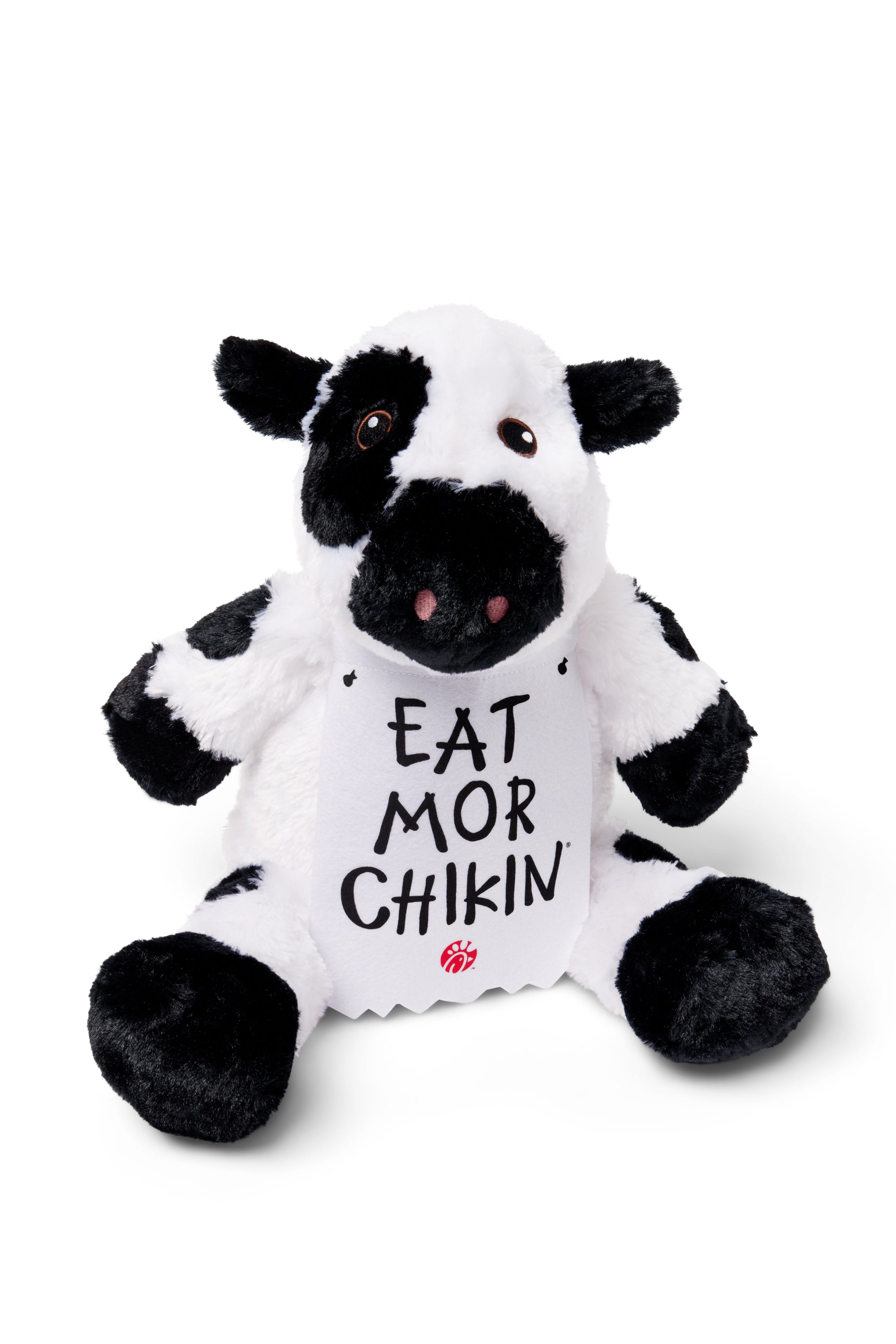 Sitting Cuddly Plush Cow wearing sign that says "EAT MOR CHIKIN"