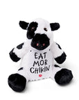Sitting Cuddly Plush Cow wearing sign that says "EAT MOR CHIKIN"