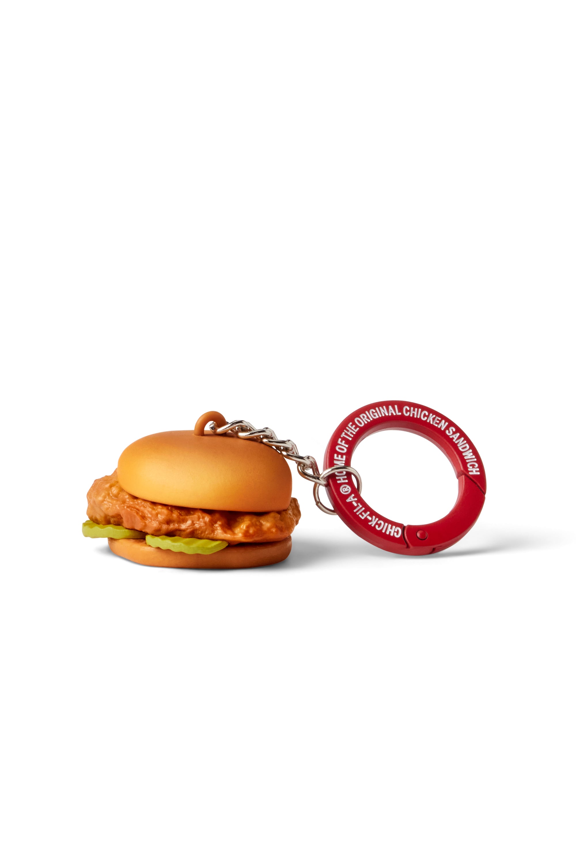 Original Chick-fil-A® Chicken Sandwich keychain sitting with metal links and red circle carabiner to the side
