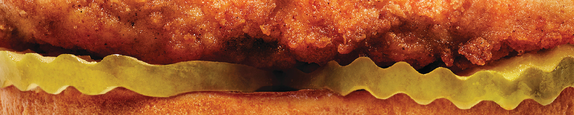 Close up of Original Chick-fil-A® Chicken Sandwich with pickles