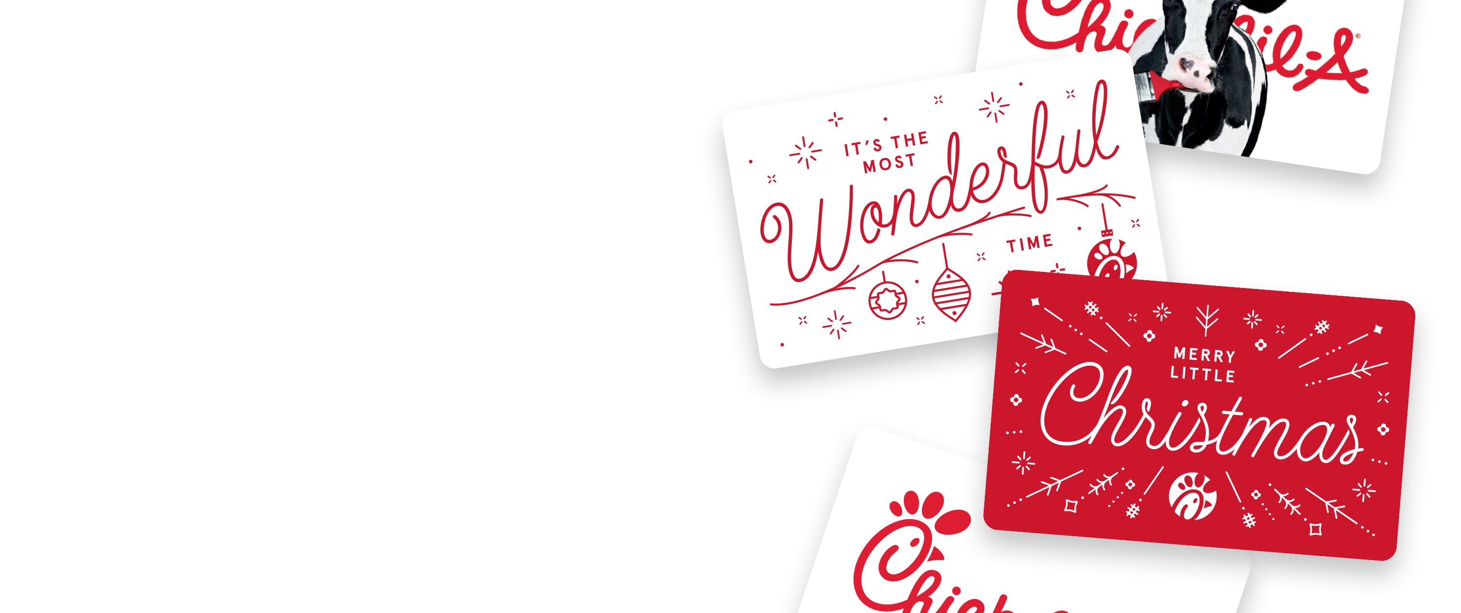 Overhead of four holiday-themed Chick-fil-A Restaurant Gift Cards 