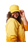 Yellow Trucker Hat - Honey Mustard on woman with curly brunette hair