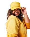 Yellow Trucker Hat - Honey Mustard on woman with curly brunette hair