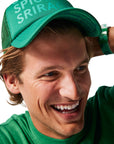 Green/Sweet & Spicy Sriracha Trucker Hat on man with blonde hair