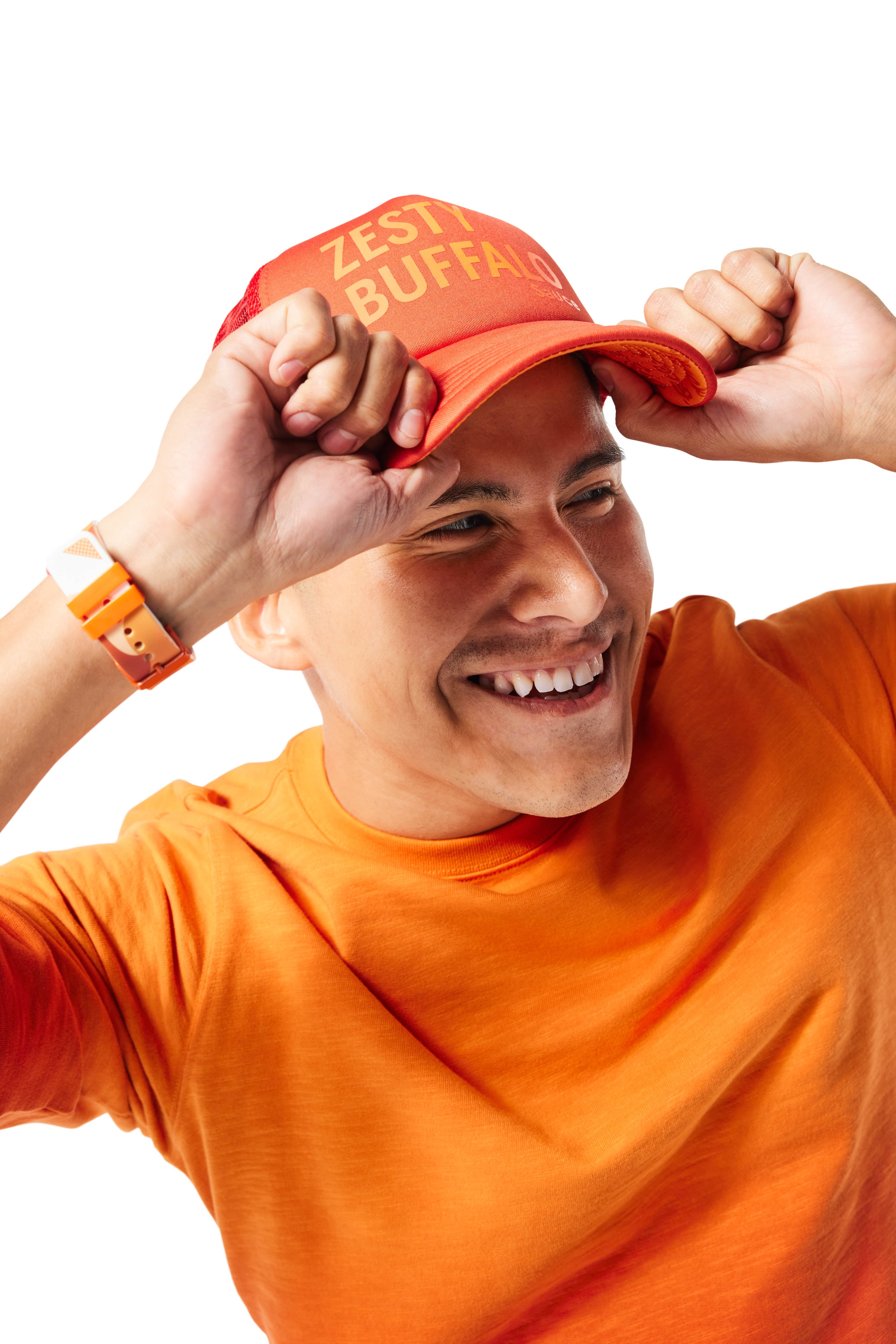 Orange/Zesty Buffalo Trucker Hat on man with brunette hair