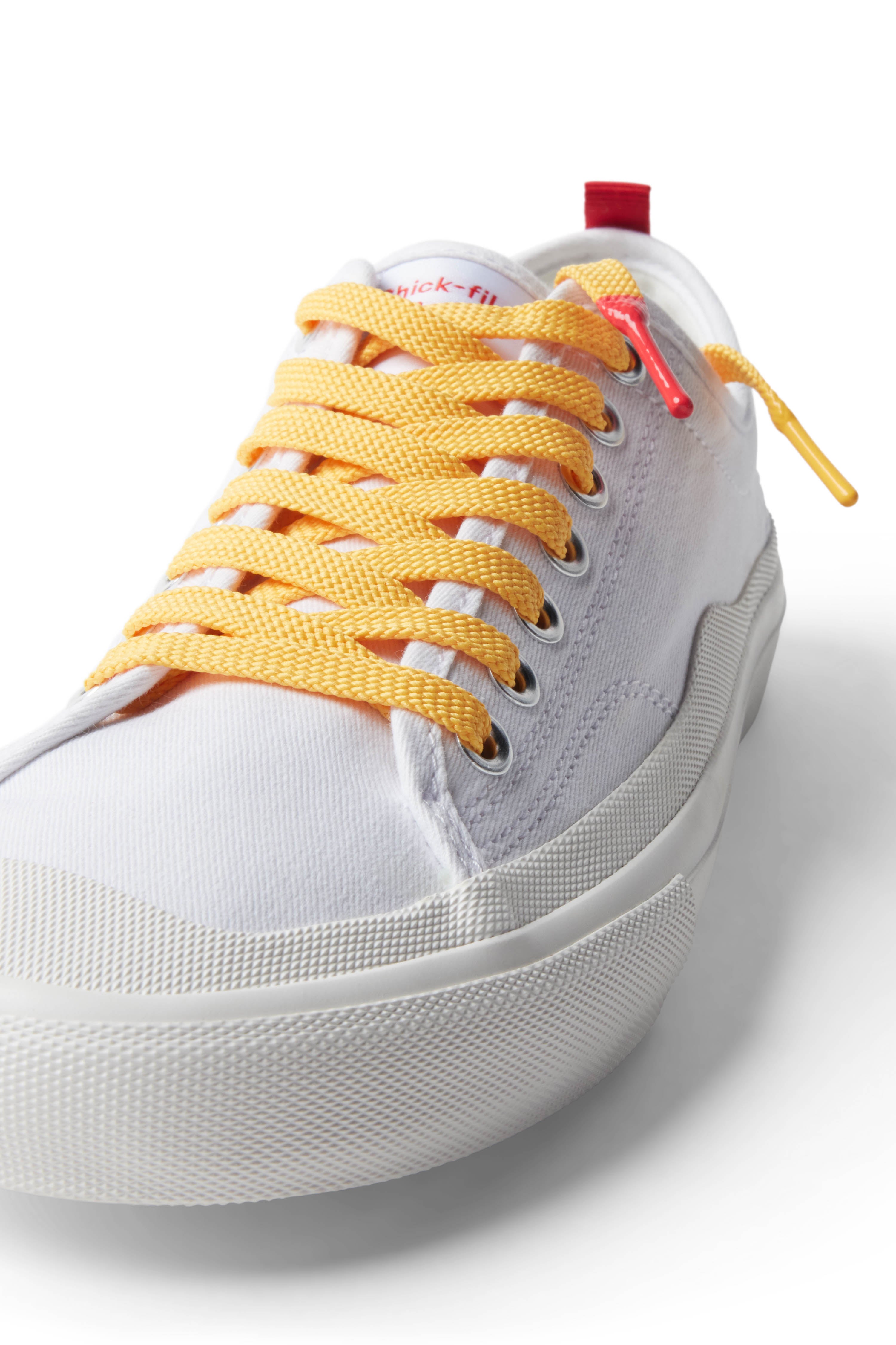 Yellow/Honey Mustard Sauce Shoelace laced up on white shoe