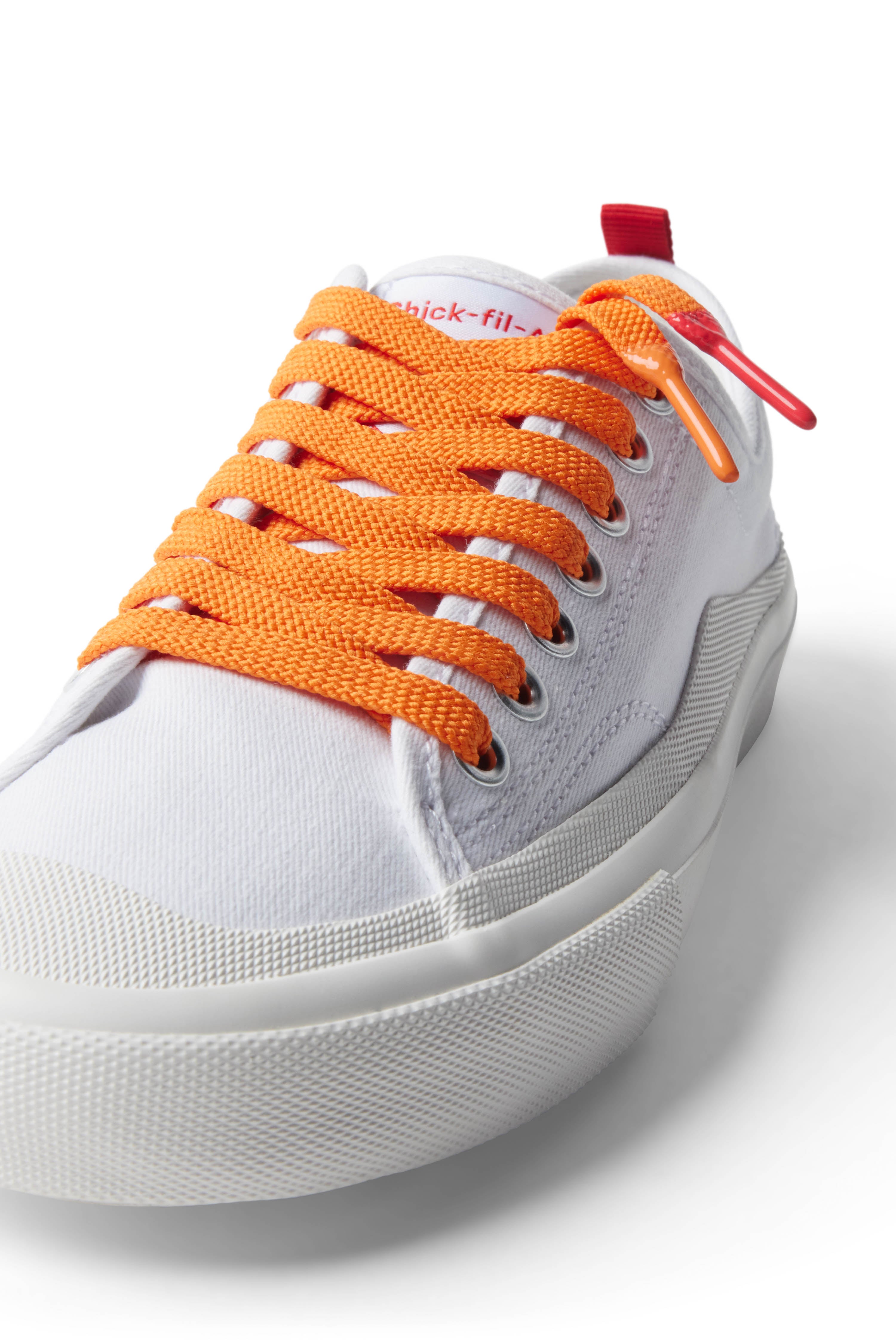 Orange/Zesty Buffalo Sauce Shoelace laced up on white shoe