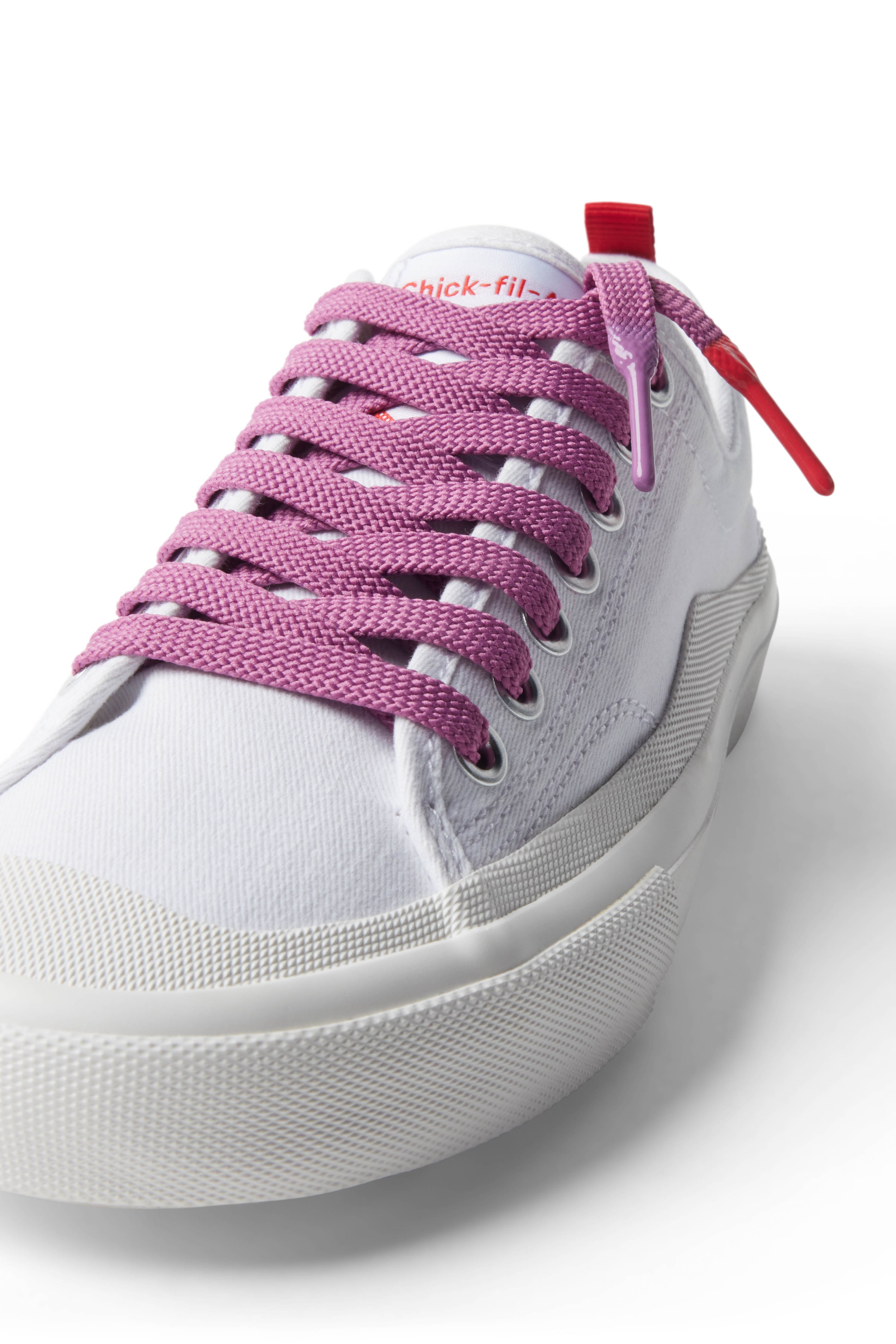 Purple/Polynesian Sauce Shoelace laced up on white shoe