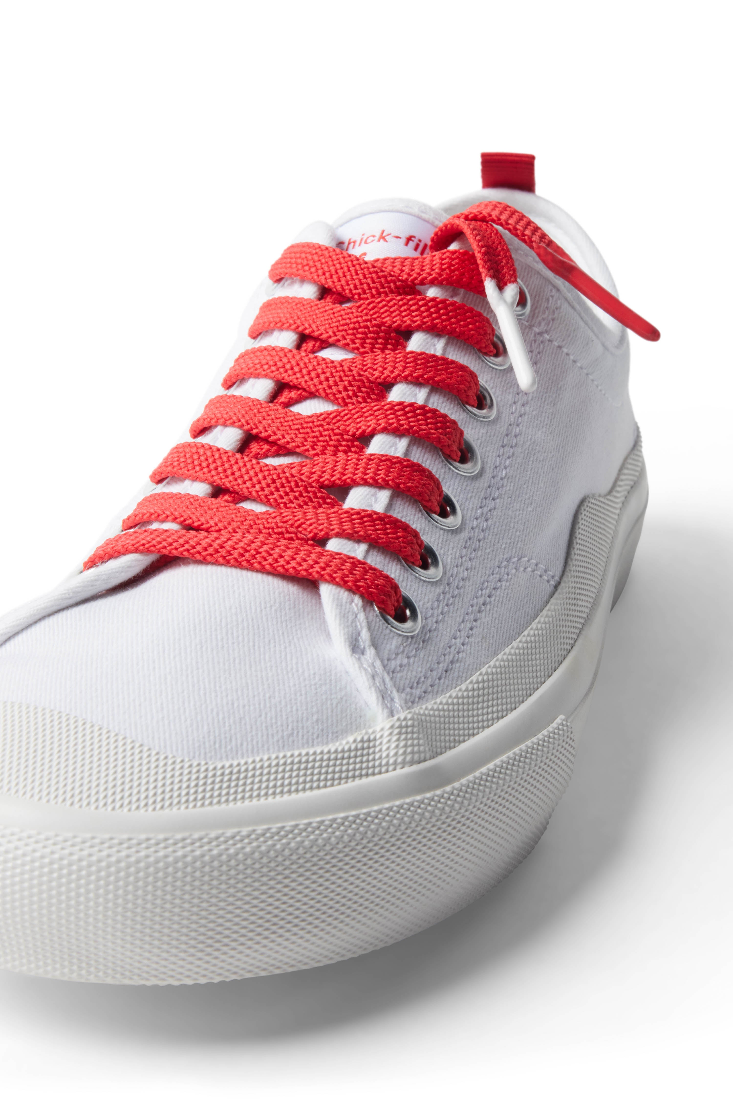 Red/Barbeque Sauce  Shoelace laced up on white shoe