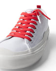 Red/Barbeque Sauce  Shoelace laced up on white shoe