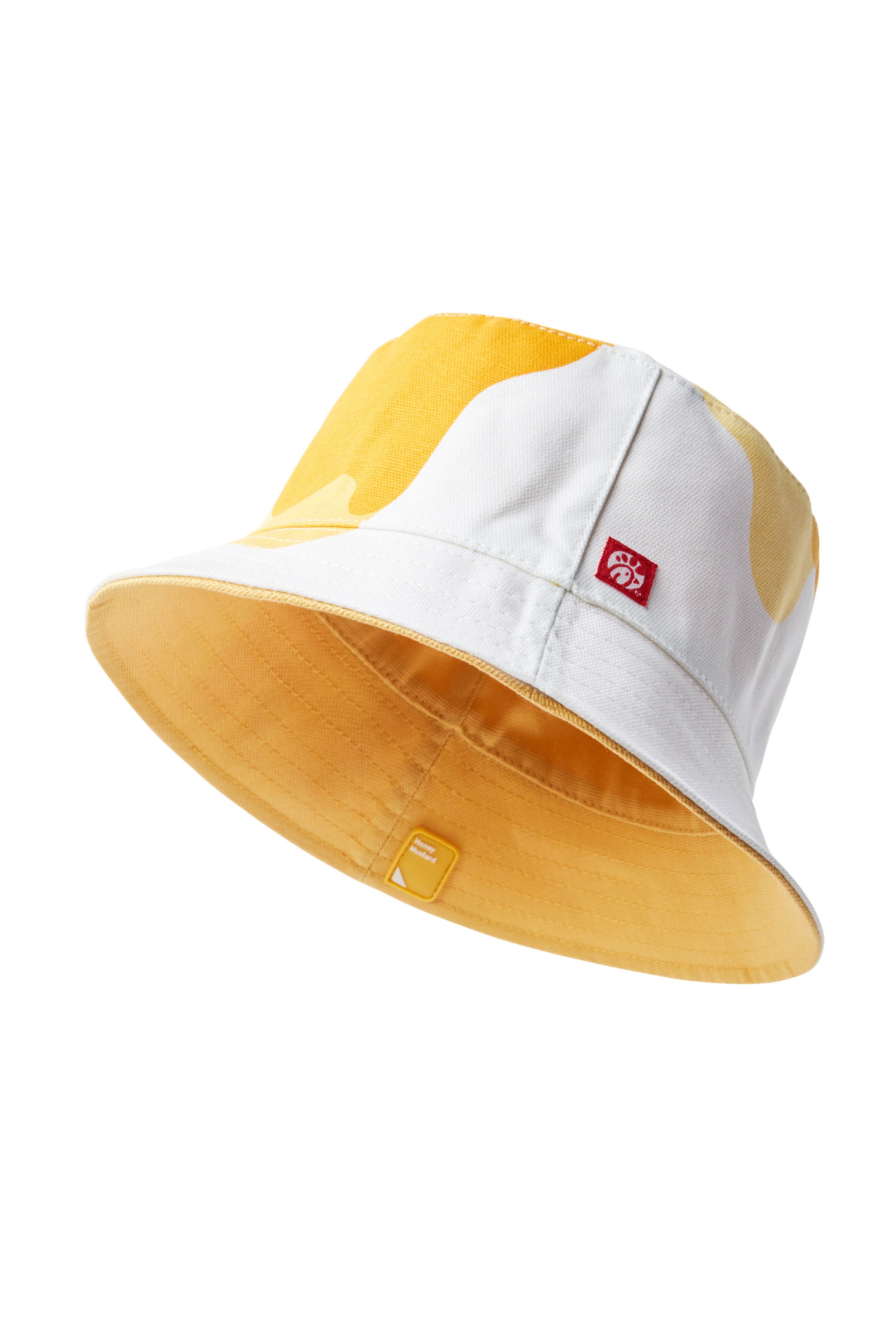 Single Yellow/Honey Mustard Sauce Reversible Bucket Hat with drip pattern on exterior and solid color on interior