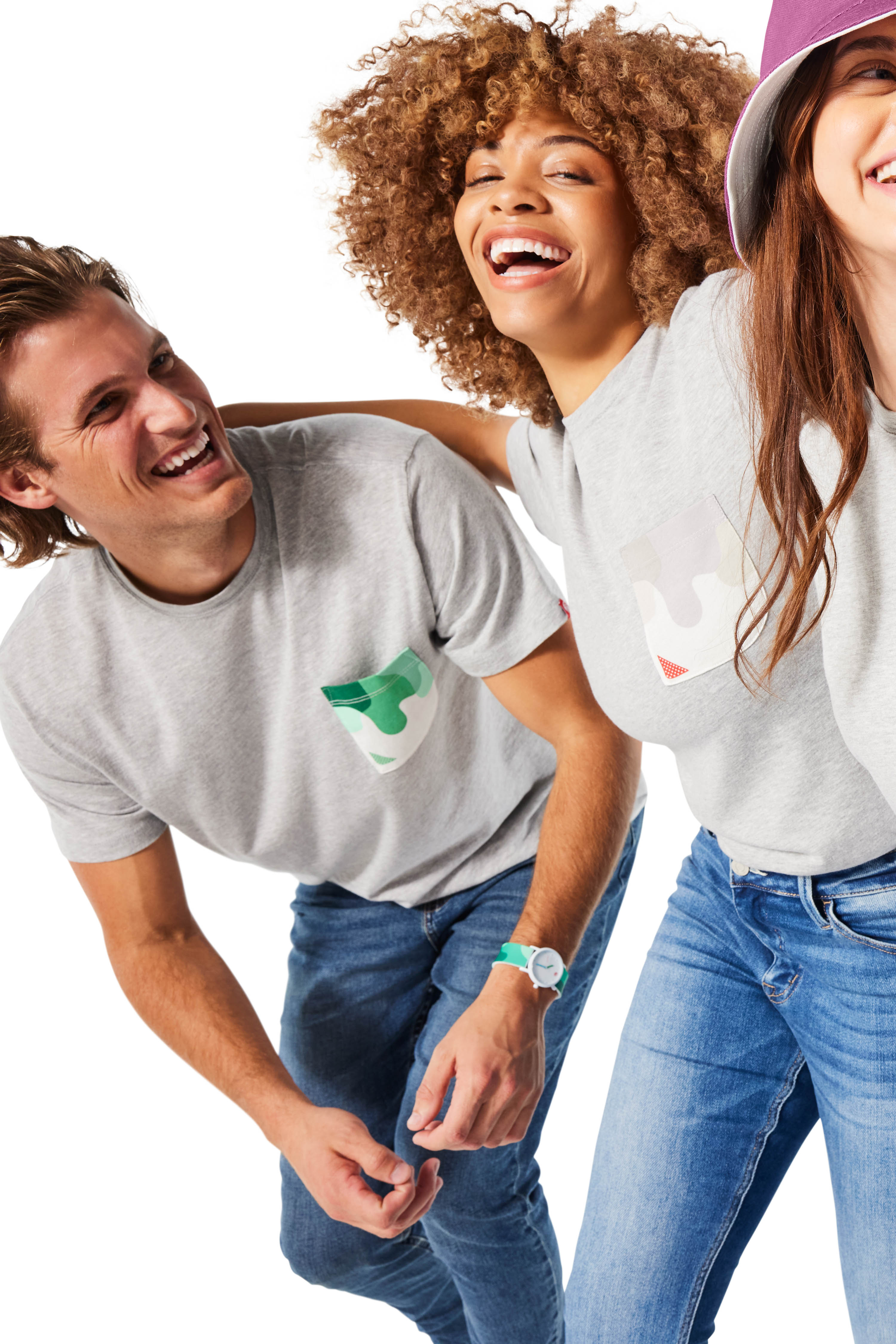 Two women and one man wearing Sauce Drip Pocket Tees (gray shirts with green, gray, and purple pockets)