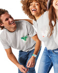 Two women and one man wearing Sauce Drip Pocket Tees (gray shirts with green, gray, and purple pockets)