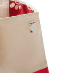 Closeup of silicone sauce patch on canvas and red Chick-fil-A Sauce Oversiized Tote Bag