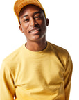 Yellow Trucker Hat on man with head tilted up displaying tone-on-tone yellow underbill