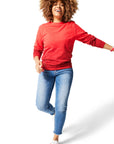 Woman walking wearing red Ombre Crewneck with red Dipped Kicks shoes