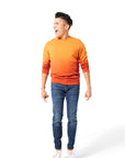 Man jumping in air wearing orange Ombre Crewneck with orange Dipped Kicks shoes