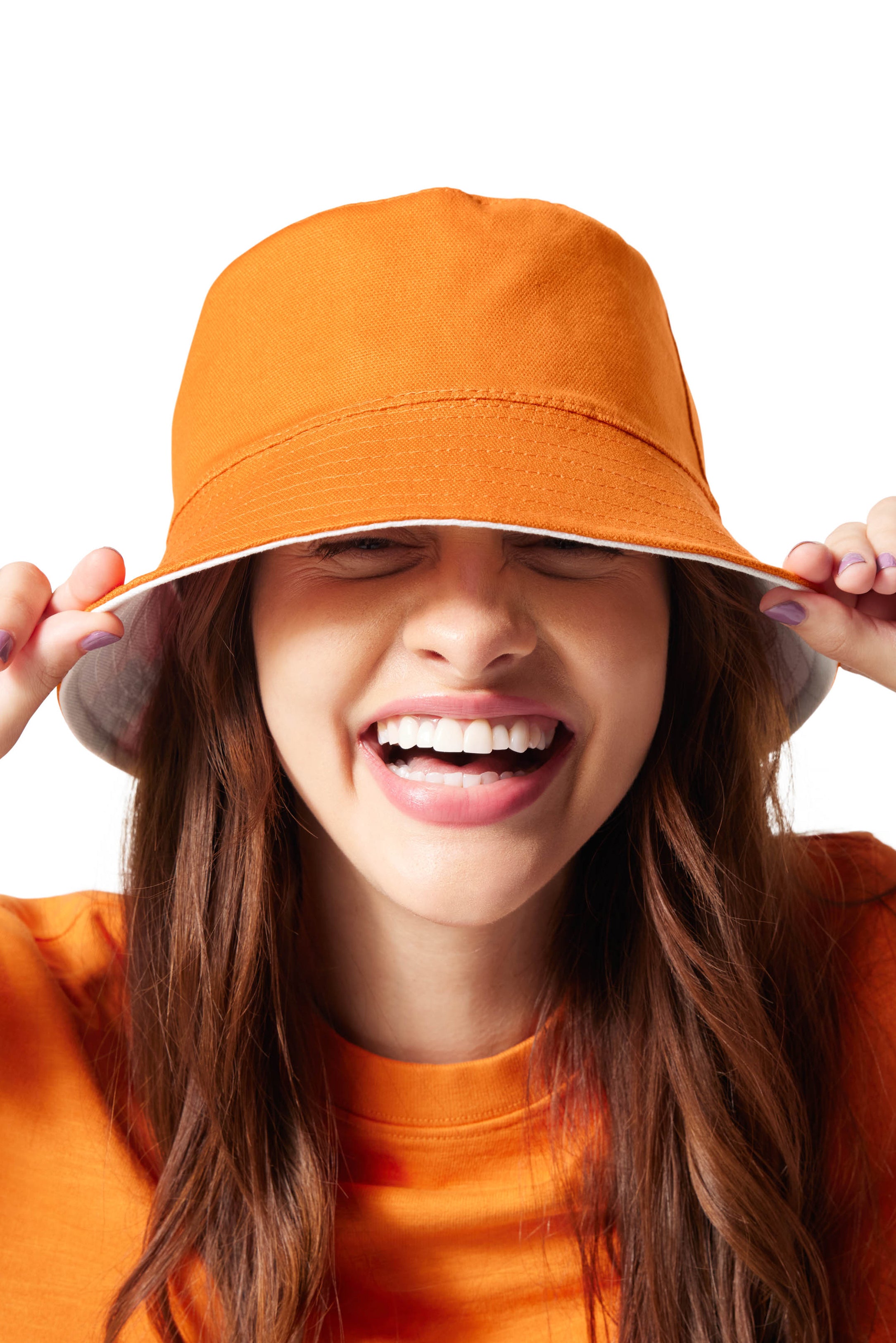 Orange/Zesty Buffalo Sauce Reversible Bucket Hat on girl with brunette hair