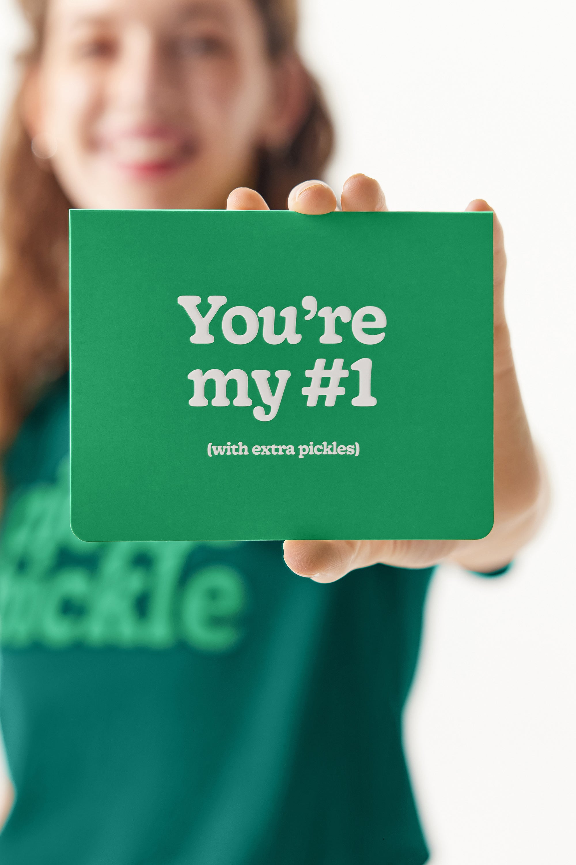 Woman holding “You’re my #1” notecard