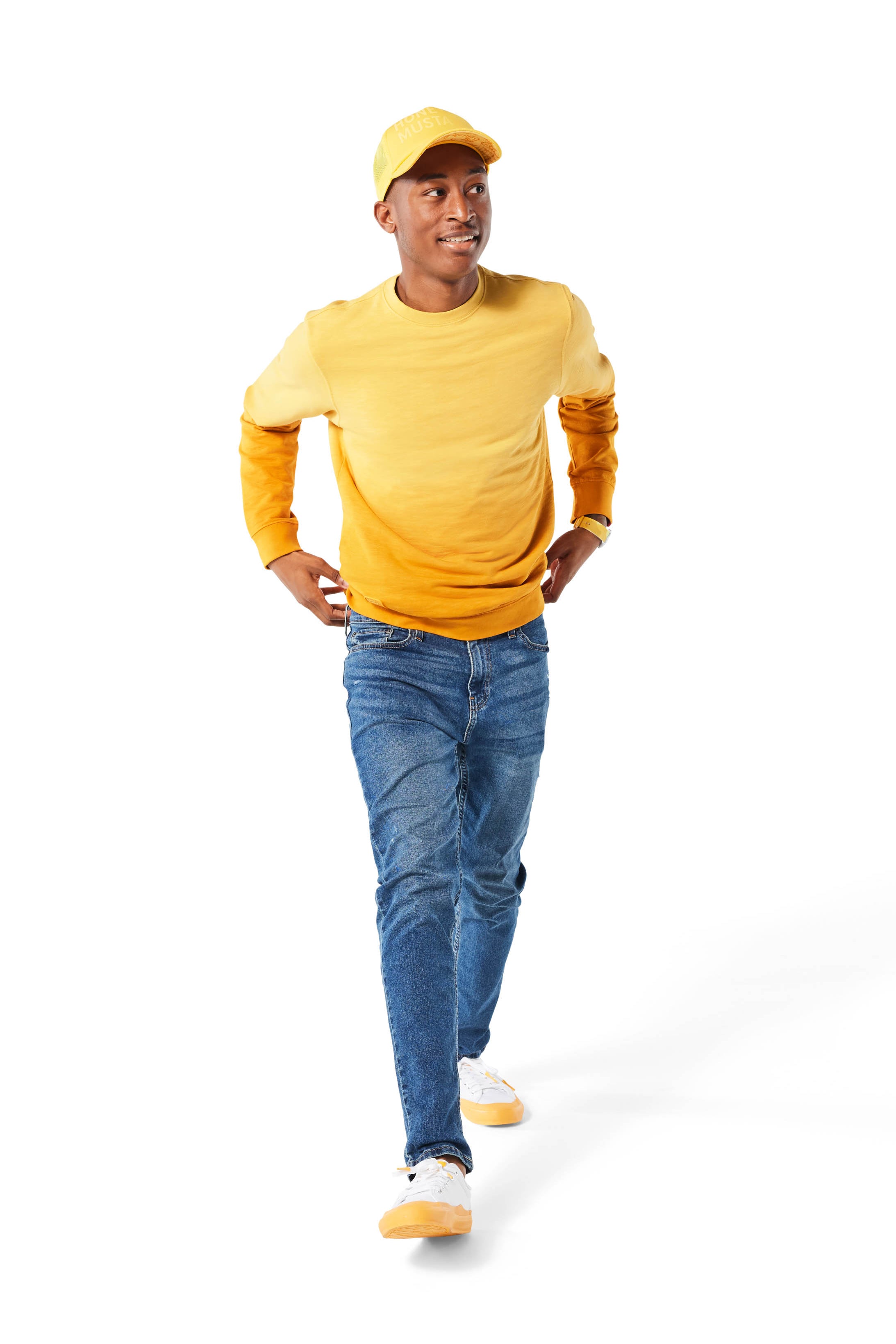 Man walking wearing yellow Ombre Crewneck with yellow Dipped Kicks shoes